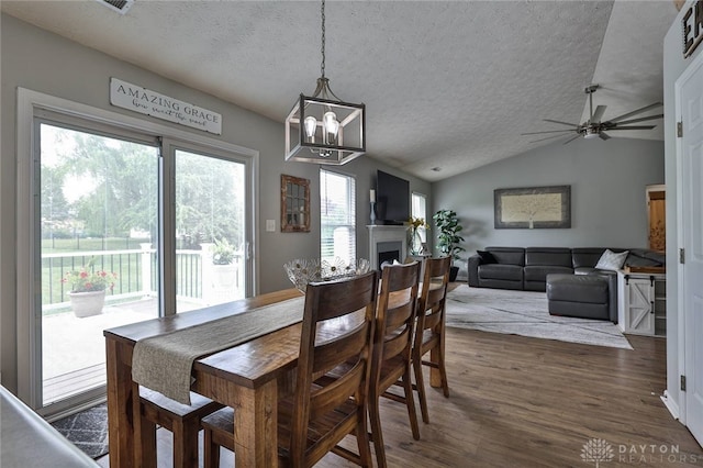 11 Green Meadow Ct, Franklin, OH 45005 - dining space featuring a textured ceiling, lofted ceiling, dark wood-type flooring, ceiling fan, and a chandelier