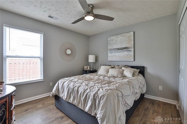 11 Green Meadow Ct, Franklin, OH 45005 - bedroom featuring wood finished floors, a textured ceiling, a closet, and a ceiling fan