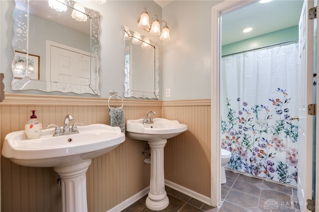 9256 Amchar Ct, Dayton, OH 45458 - bathroom with wainscoting, tile patterned floors, and curtained shower
