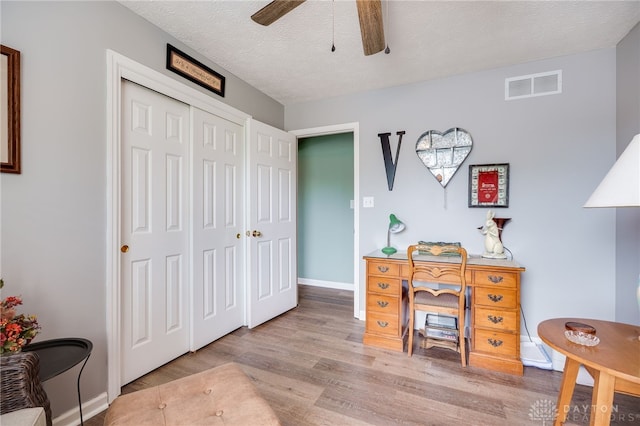 9256 Amchar Ct, Dayton, OH 45458 - office area featuring ceiling fan, wood finished floors, and a textured ceiling