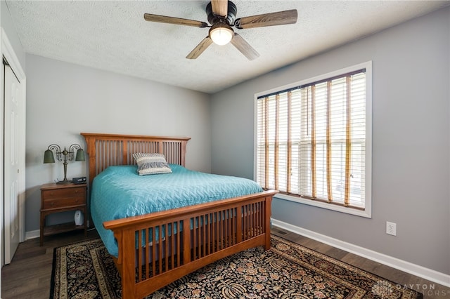 9256 Amchar Ct, Dayton, OH 45458 - bedroom with a textured ceiling, a closet, wood finished floors, and a ceiling fan