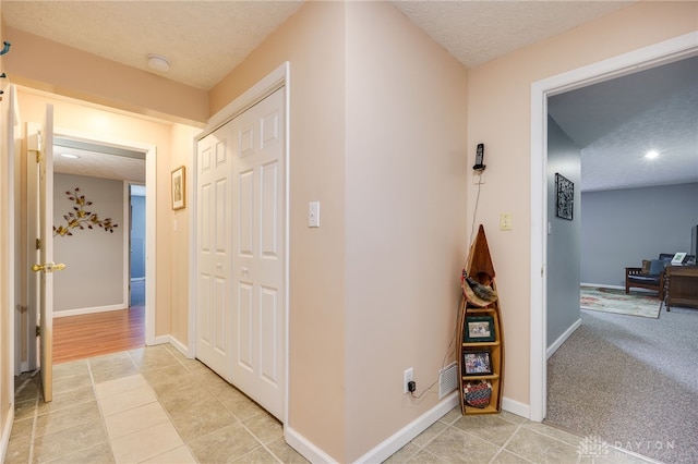 9256 Amchar Ct, Dayton, OH 45458 - hall with a textured ceiling, light tile patterned floors, and recessed lighting