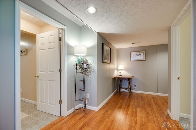 9256 Amchar Ct, Dayton, OH 45458 - hall featuring light wood-style flooring and a textured ceiling