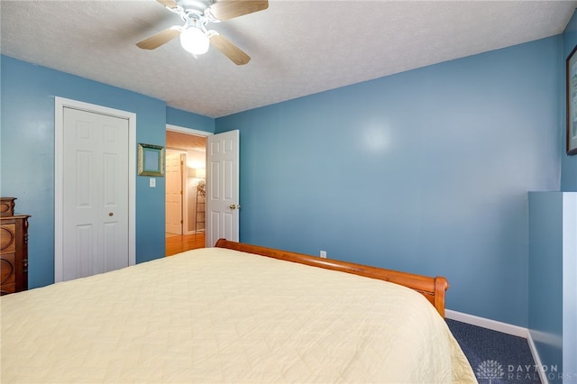 9256 Amchar Ct, Dayton, OH 45458 - bedroom with a ceiling fan, a textured ceiling, a closet, and carpet