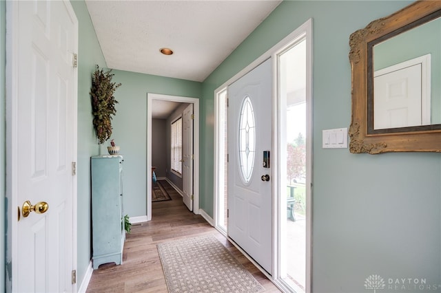 9256 Amchar Ct, Dayton, OH 45458 - foyer entrance with light wood finished floors and baseboards