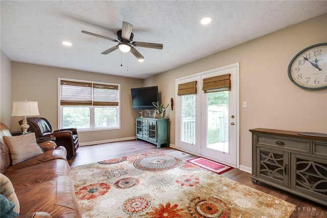 9256 Amchar Ct, Dayton, OH 45458 - living room with wood finished floors, ceiling fan, a textured ceiling, and recessed lighting