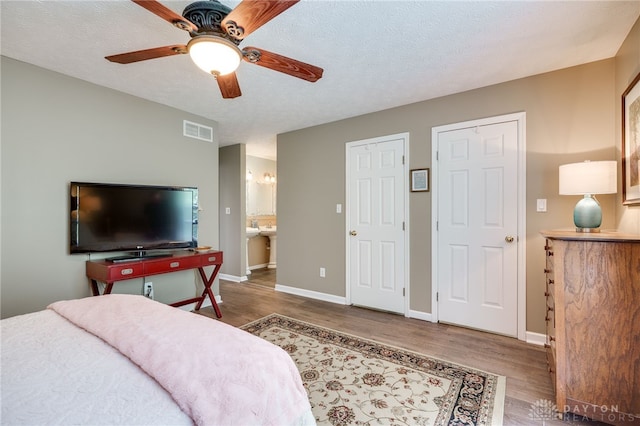9256 Amchar Ct, Dayton, OH 45458 - bedroom featuring wood finished floors, ceiling fan, and ensuite bath