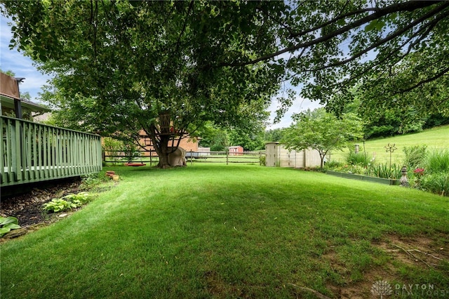 9256 Amchar Ct, Dayton, OH 45458 - view of yard featuring a storage unit and a wooden deck
