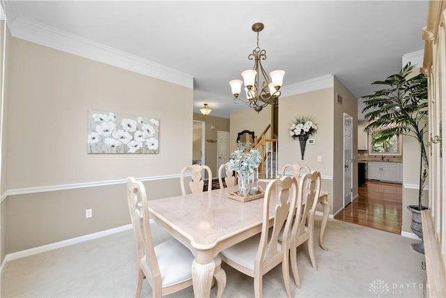 1027 W Bridlepath Ln, Miami Twp, OH 45140 - dining space featuring a chandelier, light colored carpet, and ornamental molding