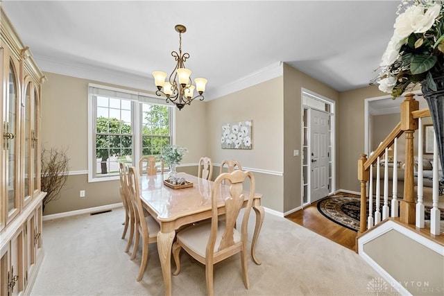 1027 W Bridlepath Ln, Miami Twp, OH 45140 - dining area with a chandelier, stairway, crown molding, and light colored carpet