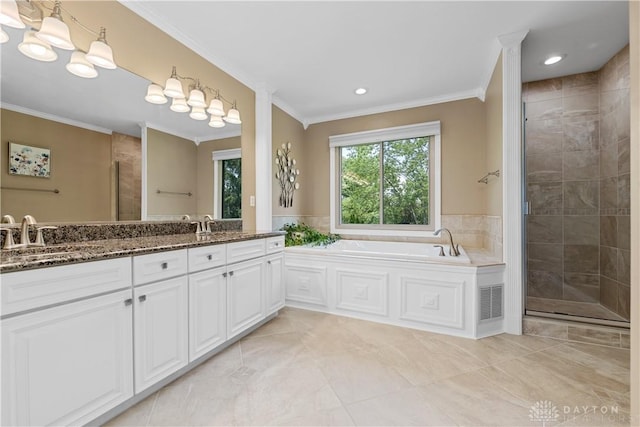 1027 W Bridlepath Ln, Miami Twp, OH 45140 - full bath featuring double vanity, a stall shower, tile patterned flooring, ornamental molding, and a garden tub