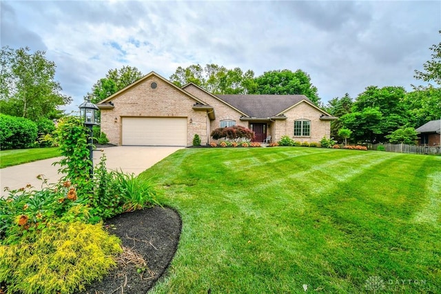 2690 Langtree Ln, Washington Twp, OH 45458 - single story home featuring concrete driveway, a garage, and brick siding