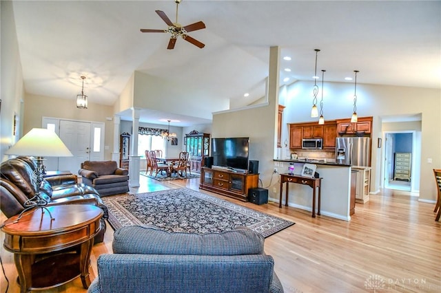 2690 Langtree Ln, Washington Twp, OH 45458 - living area featuring light wood finished floors, a ceiling fan, high vaulted ceiling, recessed lighting, and a chandelier