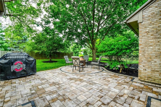 2690 Langtree Ln, Washington Twp, OH 45458 - fenced backyard with a grill and a patio area