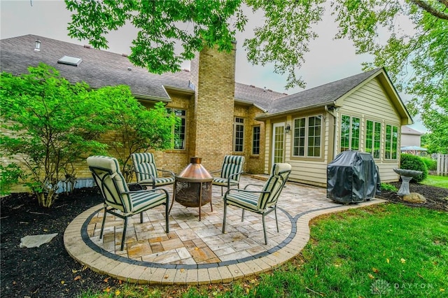 2690 Langtree Ln, Washington Twp, OH 45458 - view of patio / terrace featuring area for grilling and a fire pit