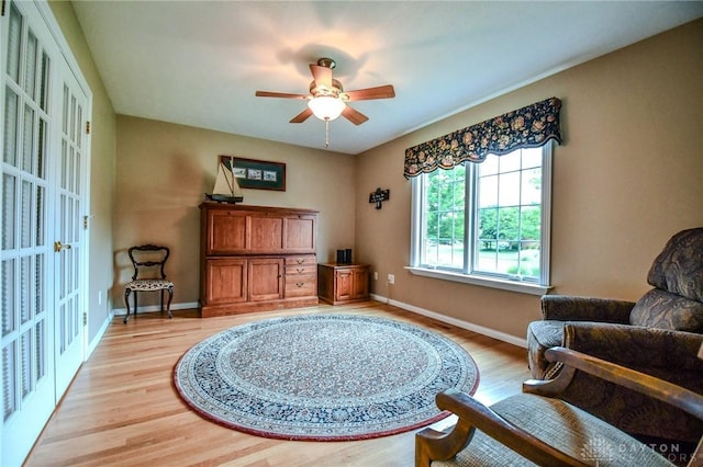 2690 Langtree Ln, Washington Twp, OH 45458 - sitting room with light wood-type flooring, a ceiling fan, and french doors