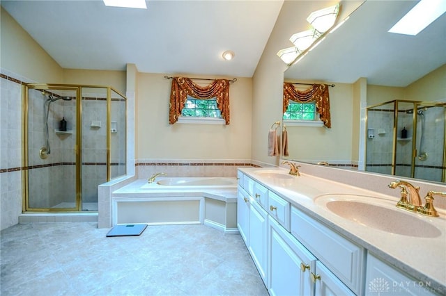 2690 Langtree Ln, Washington Twp, OH 45458 - bathroom featuring a stall shower, a garden tub, double vanity, and a skylight