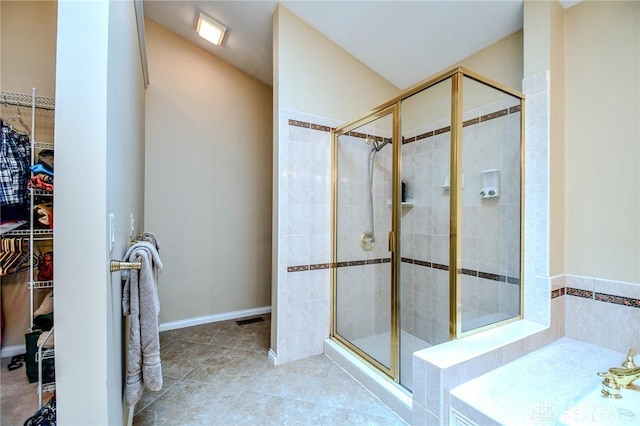 2690 Langtree Ln, Washington Twp, OH 45458 - full bathroom with a spacious closet, a shower stall, and tile patterned floors