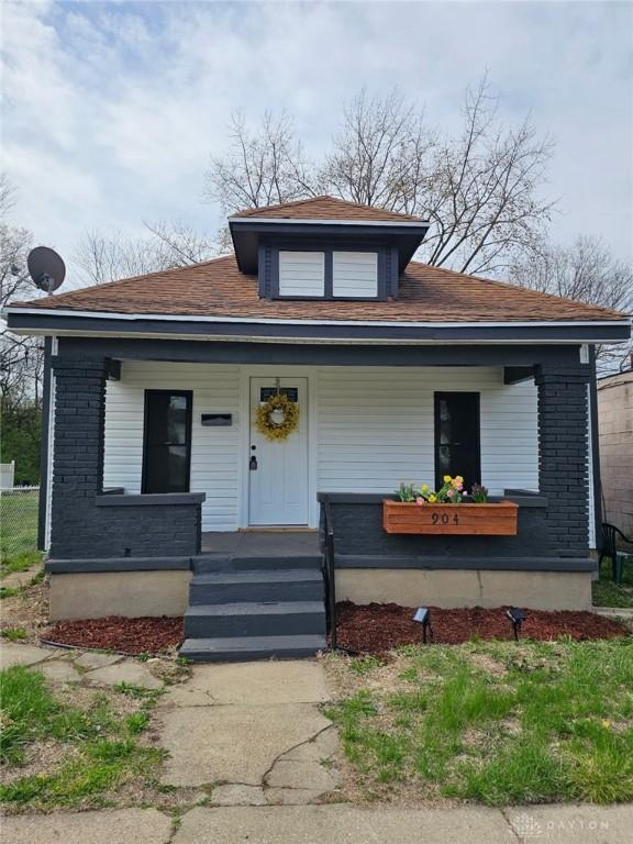 904 Crawford St, Middletown, OH 45044 - bungalow-style house with covered porch, brick siding, and roof with shingles