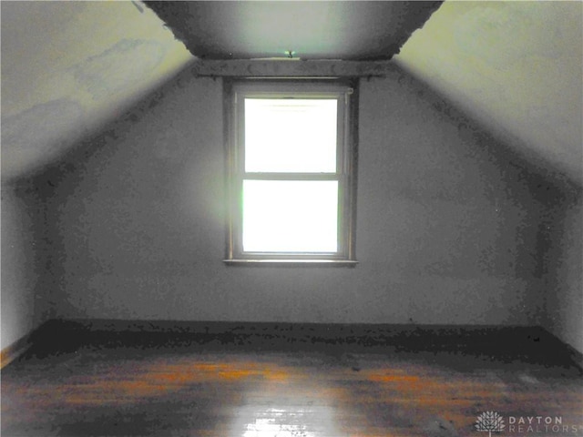 9705 E Haskett Ln, Bethel Twp, OH 45424 - bonus room featuring wood finished floors, plenty of natural light, and vaulted ceiling