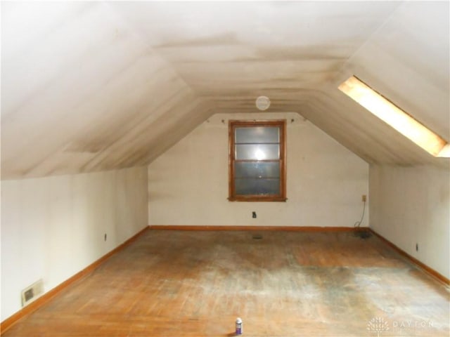 9705 E Haskett Ln, Bethel Twp, OH 45424 - bonus room featuring wood finished floors and vaulted ceiling