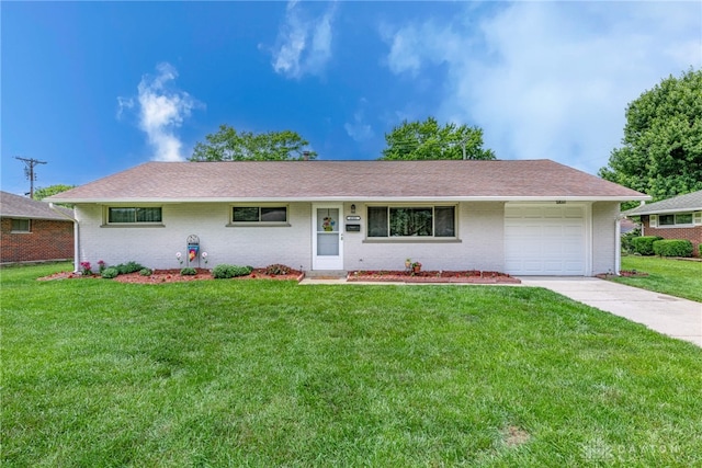 4501 Hannaford St, Miami Twp, OH 45439 - ranch-style house featuring a garage, brick siding, a front lawn, and driveway