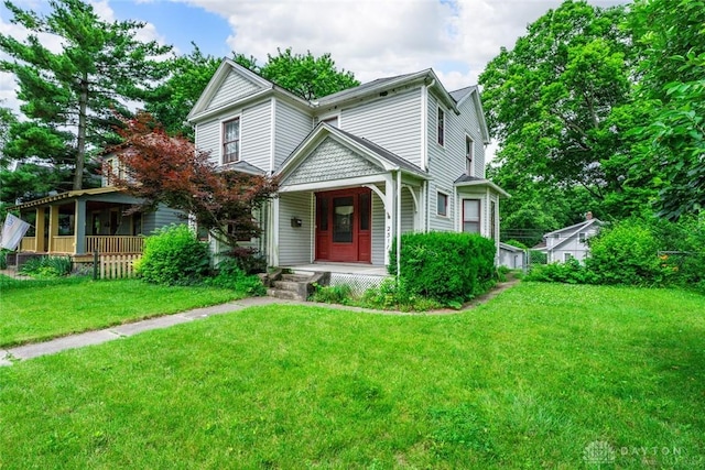 2311 S Dixie Dr, Kettering, OH 45409 - victorian house with covered porch and a front lawn