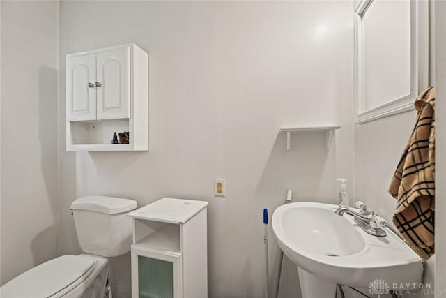 2311 S Dixie Dr, Kettering, OH 45409 - half bathroom featuring a sink and toilet