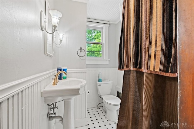 2311 S Dixie Dr, Kettering, OH 45409 - bathroom featuring a wainscoted wall and ornamental molding