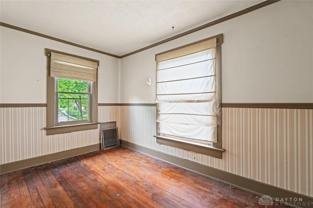 2311 S Dixie Dr, Kettering, OH 45409 - spare room with hardwood / wood-style floors, wainscoting, and crown molding