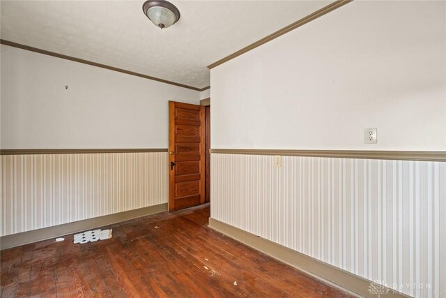 2311 S Dixie Dr, Kettering, OH 45409 - spare room with ornamental molding and hardwood / wood-style floors