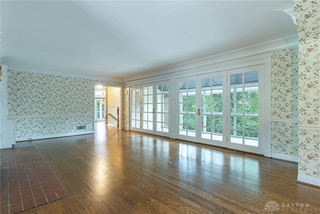 1919 Tait Circle Rd, Kettering, OH 45429 - empty room with wallpapered walls, hardwood / wood-style flooring, plenty of natural light, and crown molding