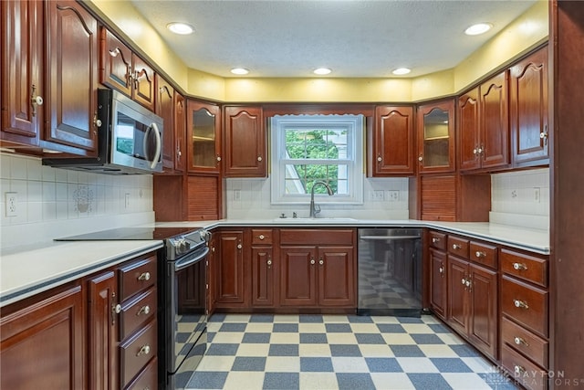 1919 Tait Circle Rd, Kettering, OH 45429 - kitchen featuring stainless steel appliances, light floors, light countertops, and recessed lighting