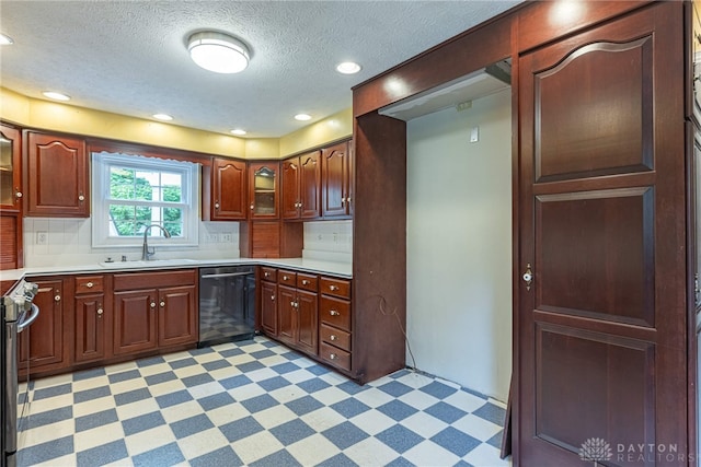 1919 Tait Circle Rd, Kettering, OH 45429 - kitchen featuring dishwasher, light flooring, tasteful backsplash, light countertops, and a textured ceiling