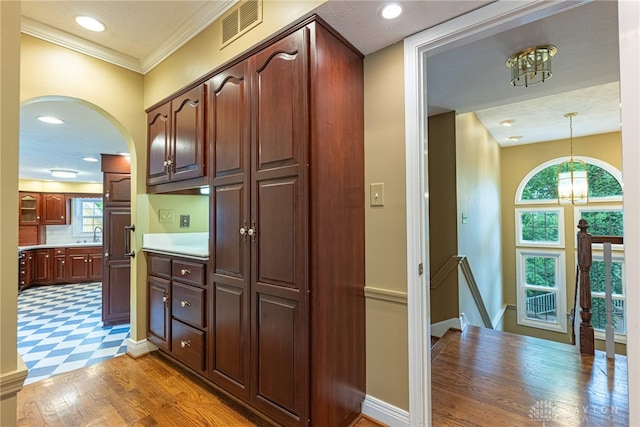 1919 Tait Circle Rd, Kettering, OH 45429 - kitchen with arched walkways, a chandelier, decorative light fixtures, light floors, and recessed lighting