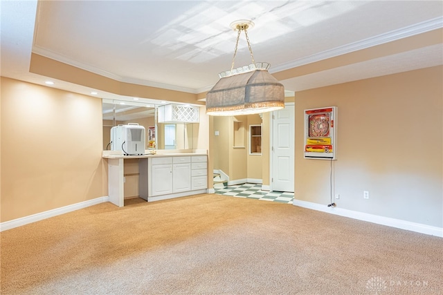 1919 Tait Circle Rd, Kettering, OH 45429 - kitchen with light carpet, crown molding, white cabinets, recessed lighting, and light countertops