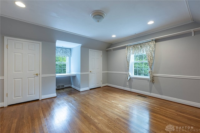 1919 Tait Circle Rd, Kettering, OH 45429 - unfurnished bedroom featuring wood finished floors, recessed lighting, lofted ceiling, and ornamental molding