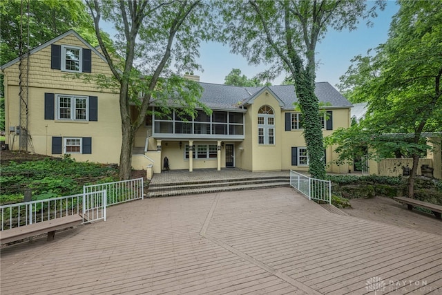 1919 Tait Circle Rd, Kettering, OH 45429 - back of house with a deck, a sunroom, and stucco siding