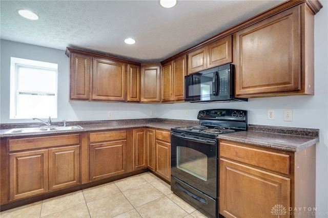1717 Pershing Ave, Middletown, OH 45044 - kitchen with black appliances, dark countertops, brown cabinetry, light tile patterned floors, and recessed lighting