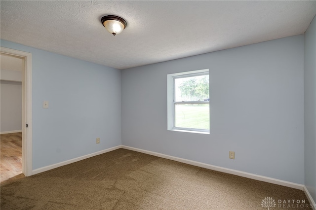 1717 Pershing Ave, Middletown, OH 45044 - unfurnished bedroom featuring carpet flooring and a textured ceiling