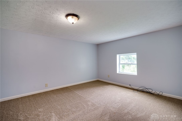 1717 Pershing Ave, Middletown, OH 45044 - spare room featuring carpet floors and a textured ceiling