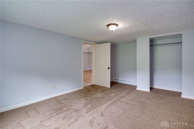 1717 Pershing Ave, Middletown, OH 45044 - unfurnished bedroom with a baseboard heating unit, carpet, a textured ceiling, and a closet