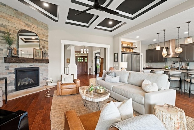 79 White Beech Ct, Springboro, OH 45066 - living room with coffered ceiling, a ceiling fan, dark wood-style floors, beam ceiling, and a fireplace