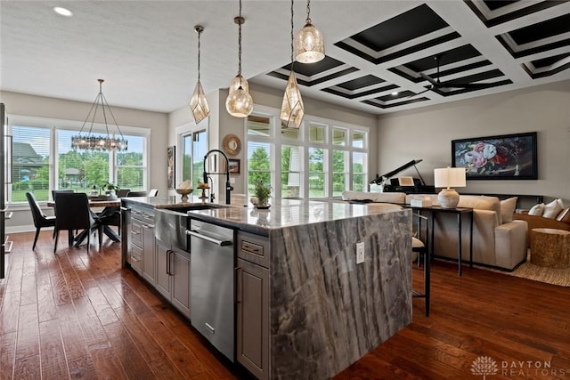 79 White Beech Ct, Springboro, OH 45066 - kitchen with stainless steel dishwasher, dark wood-style flooring, open floor plan, a center island with sink, and stone counters