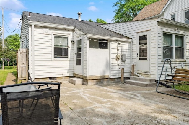 313 N High St, Wilmington, OH 45177 - rear view of house featuring entry steps, a shingled roof, and a patio area
