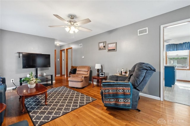 313 N High St, Wilmington, OH 45177 - living area featuring ceiling fan and wood finished floors