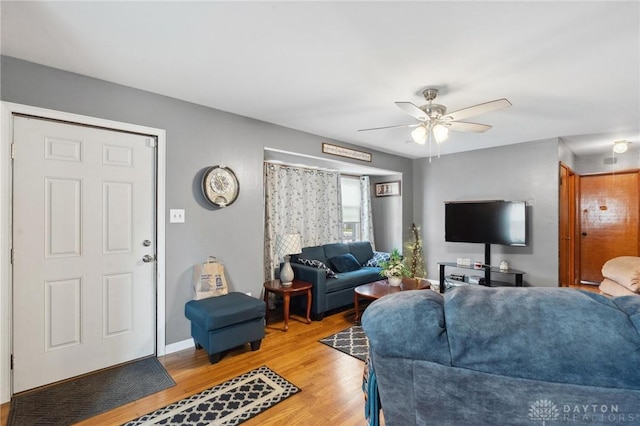 313 N High St, Wilmington, OH 45177 - living area with light wood-style floors and ceiling fan