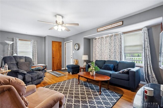 313 N High St, Wilmington, OH 45177 - living room with a ceiling fan, healthy amount of natural light, and wood finished floors