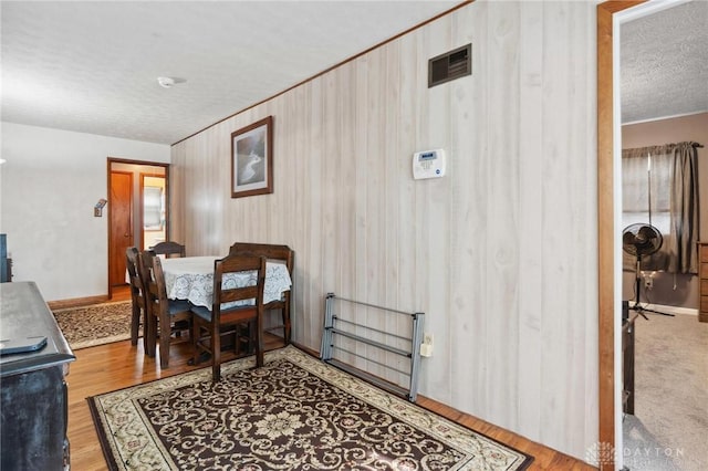 313 N High St, Wilmington, OH 45177 - dining area featuring wood finished floors and a textured ceiling