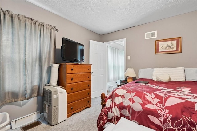 313 N High St, Wilmington, OH 45177 - bedroom with carpet floors and a textured ceiling